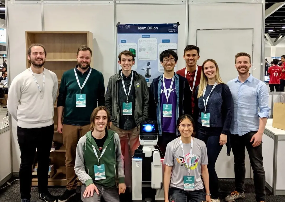 The ORIon team with their robot at the end of the 2019 Robocup competition