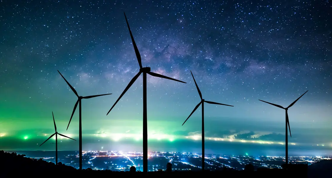 Wind turbines silhouette at night