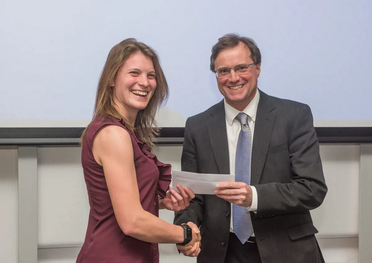 4th year student receiving her project poster prize at the lubbock lecture